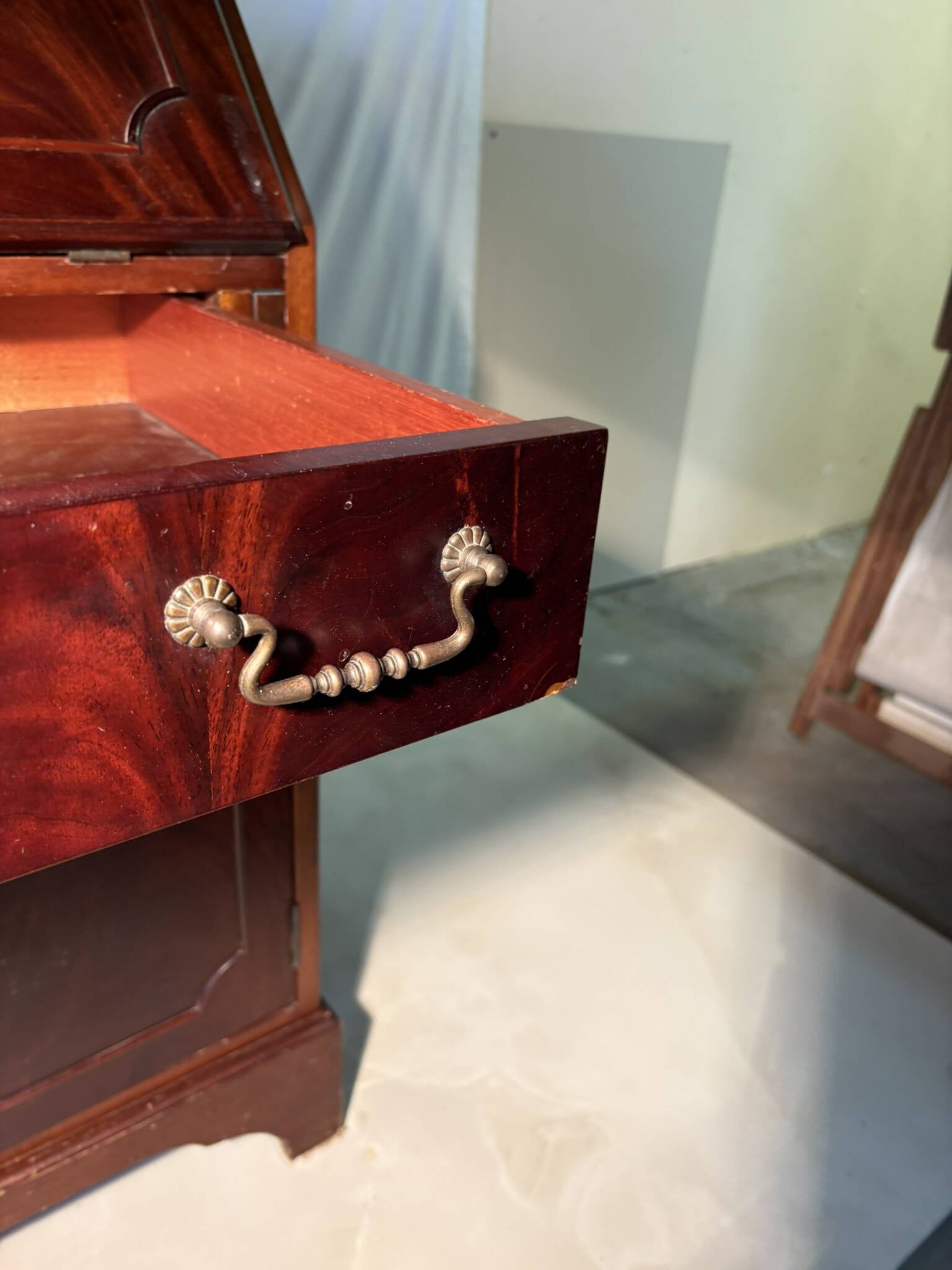 Antique mahogany secretary, upholstered flap and interior storage
