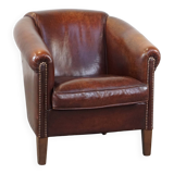 Sheepskin club armchair, correct finishing with decorative nails