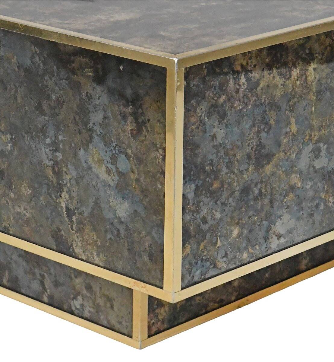 Marble glass coffee table with "solar eruption" decor.