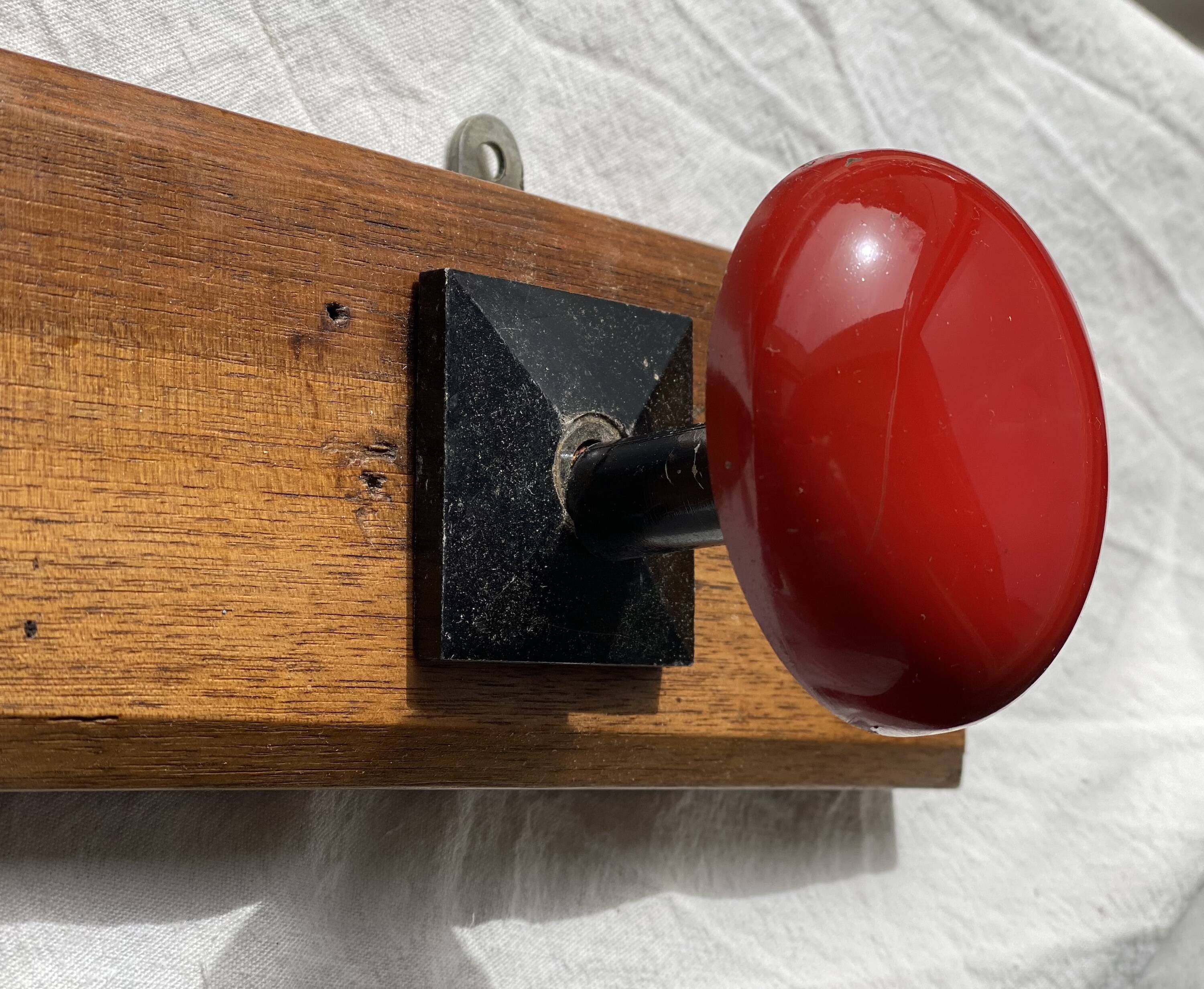 Wall-mounted coat rack with 3 hooks, vintage 1960s red lacquered metal.