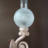 Original wall lights in pink enamelled cast iron with frosted glass globes.