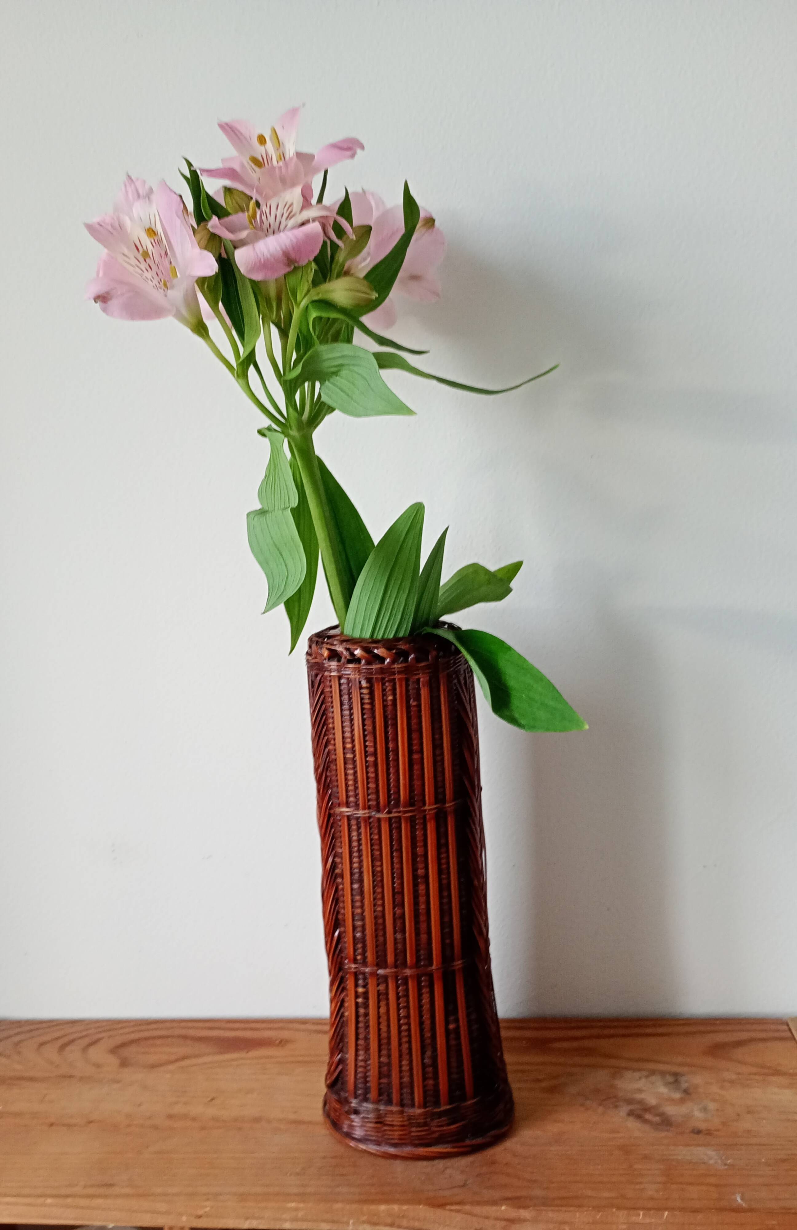 Japanese vase made of woven bamboo. Ikebana