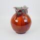 Large red and blue glazed ceramic pitcher signed Delène under the base