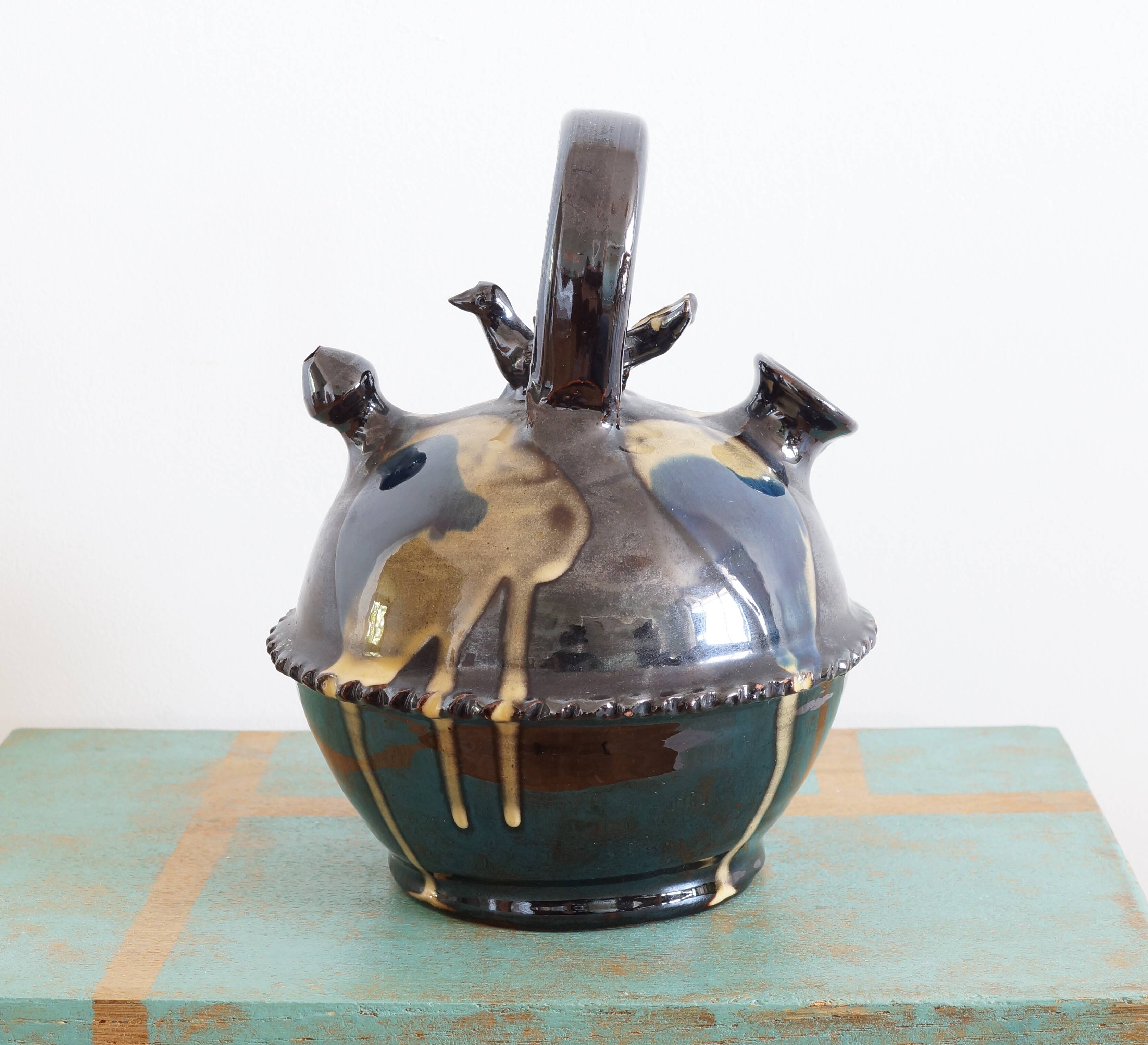 Glazed terracotta gargoulette with bird decoration