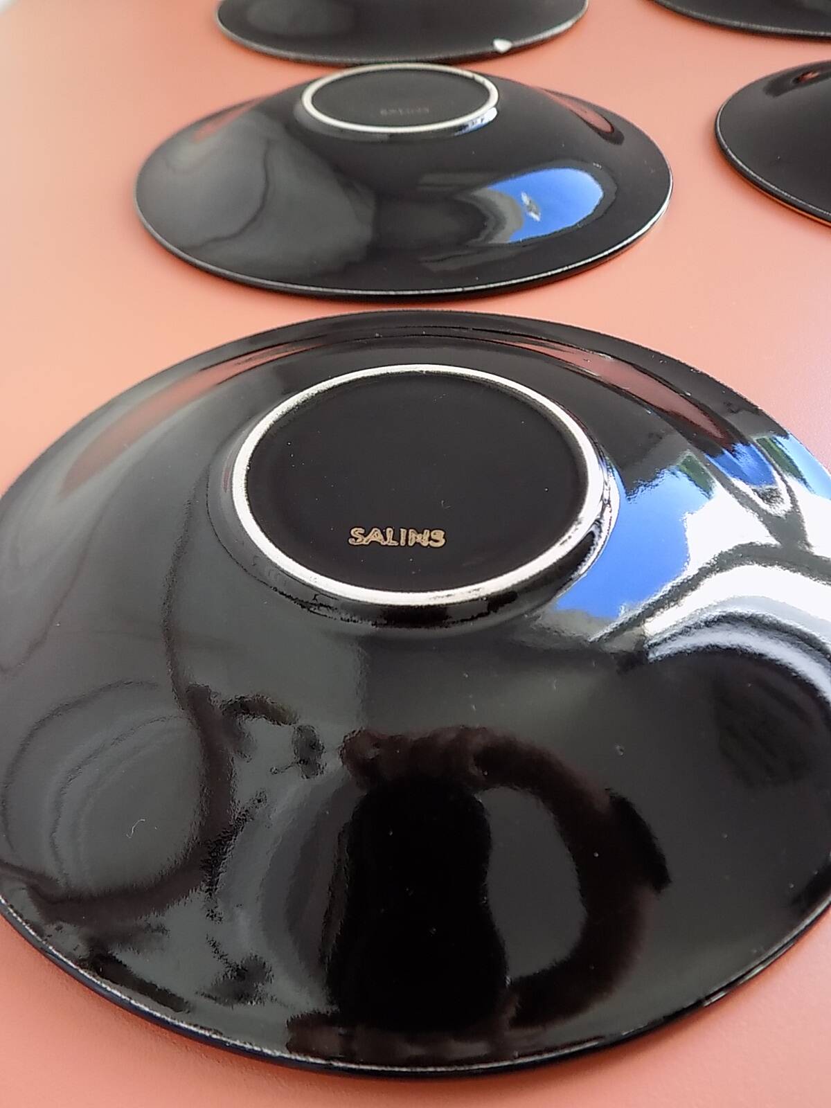 set of 9 black and gold Salins cups and saucers