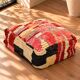 Vintage Moroccan pouf in multicoloured handmade wool.