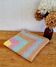 Vintage pastel crochet blanket for children.