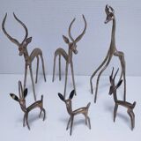 five vintage brass sculptures of gazelles, antelopes, and a giraffe
