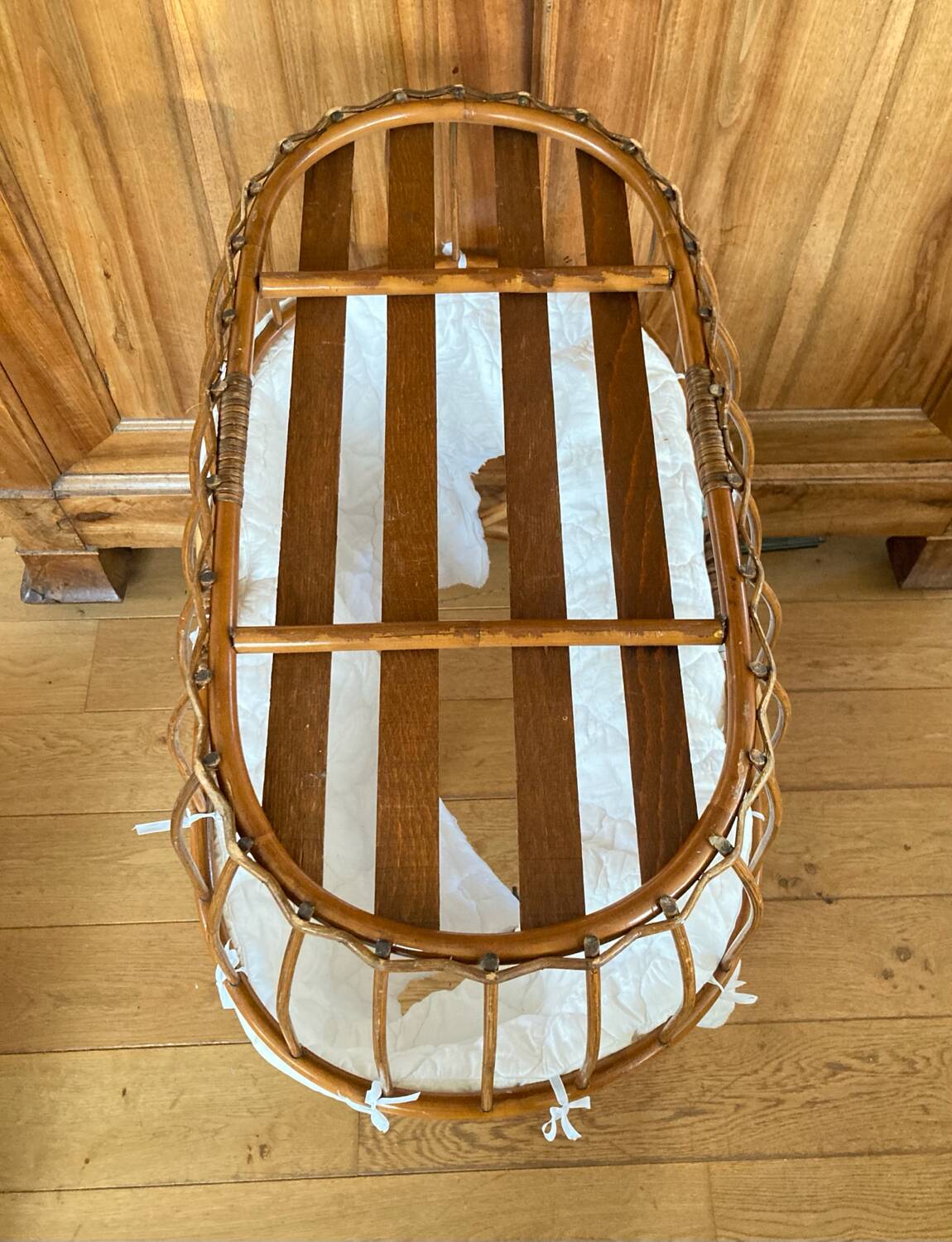 Bamboo, rattan, wicker cradle bassinet from the 1960s with a foldable support.