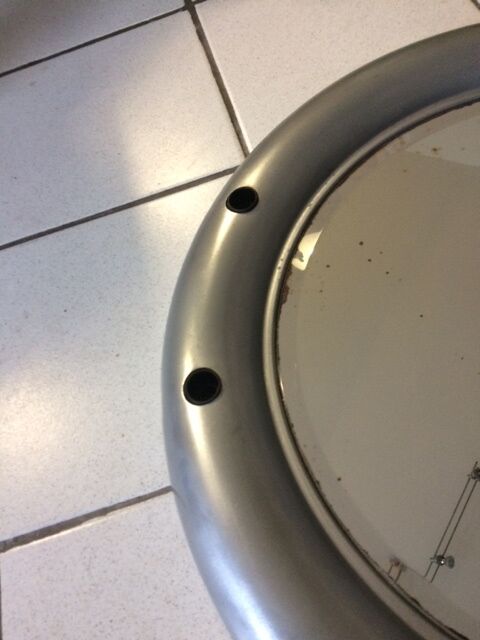 Vintage bright round bathroom mirror in metal