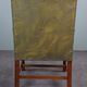 Elegant armchair and footrest in English green leather
