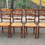 4 Louis XV chairs in solid oak with rush seats, shell carvings, 19th century.