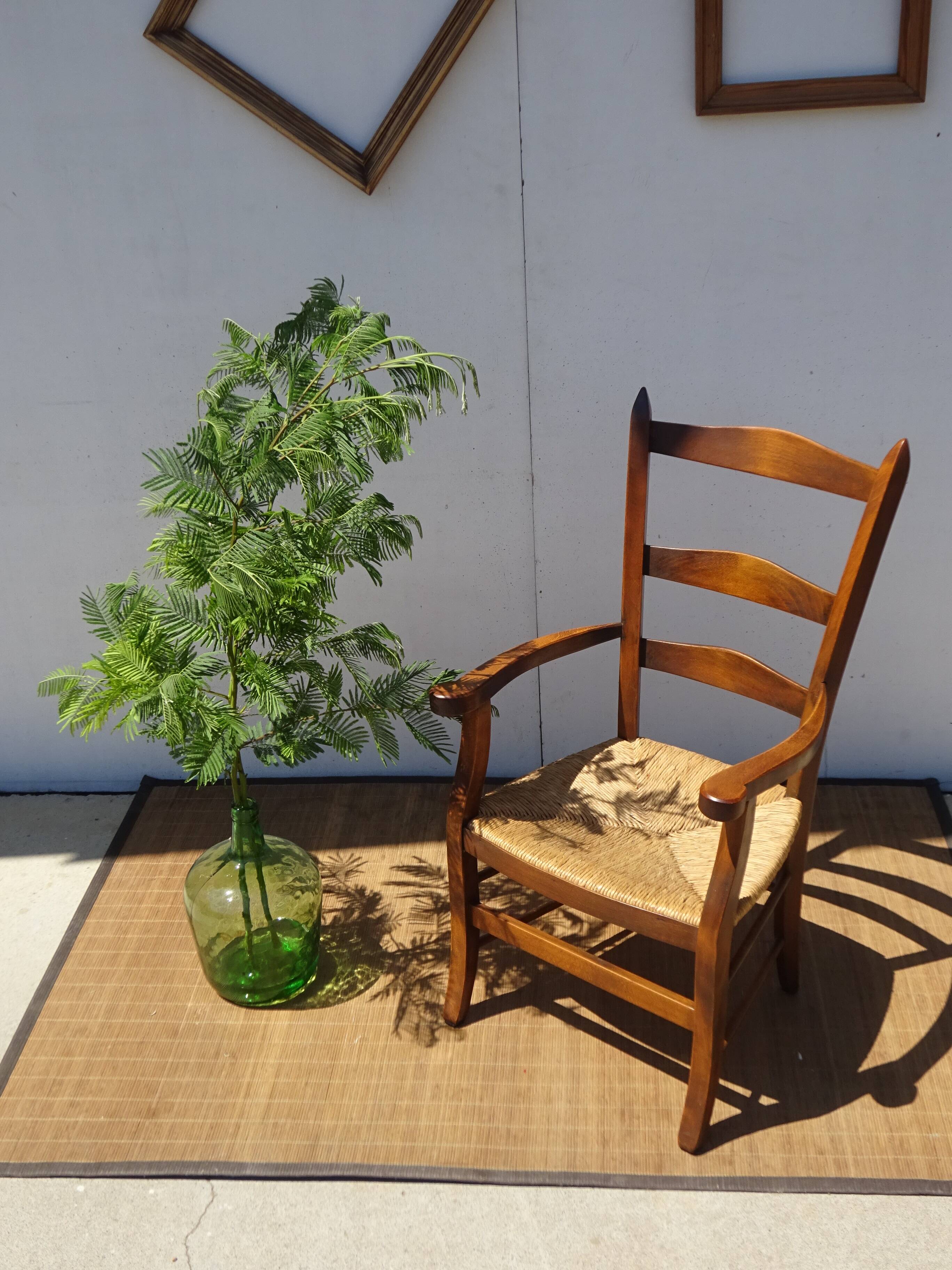 solid wood armchair, straw-covered seat