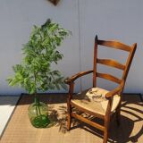 solid wood armchair, straw-covered seat