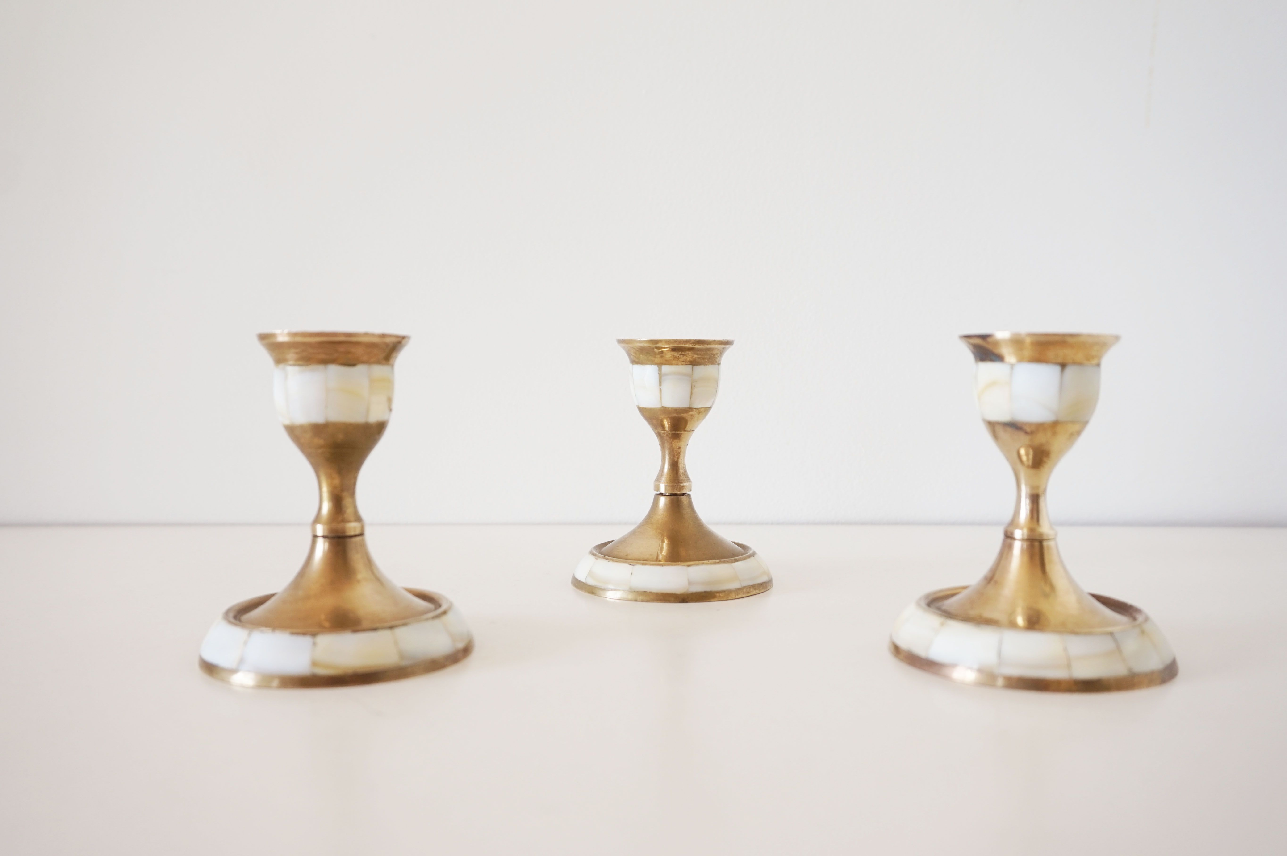 Lot of old candlesticks in brass and mother-of-pearl