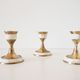 Lot of old candlesticks in brass and mother-of-pearl