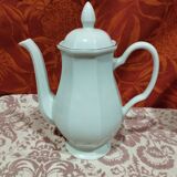 old coffee maker in white earthenware and red edging