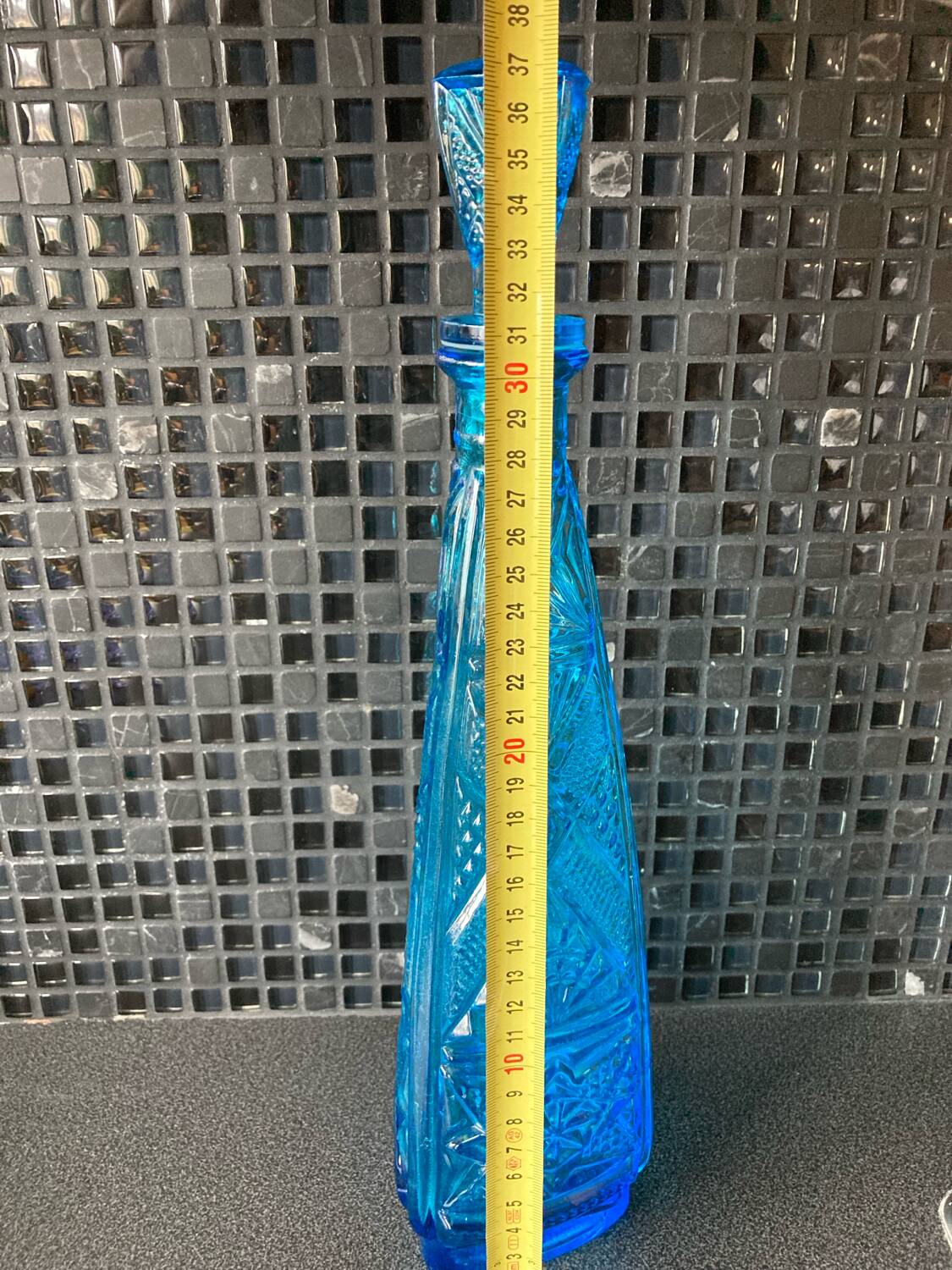 Blue chiseled glass bottle