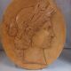 Plaster medallion, high relief, yellow ochre patina, representing the Roman divinity Ceres