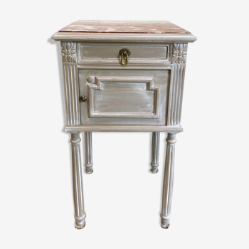 Patinated gray bedside table above Henri marble