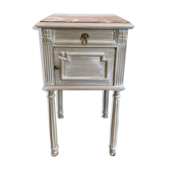 Patinated gray bedside table above Henri marble