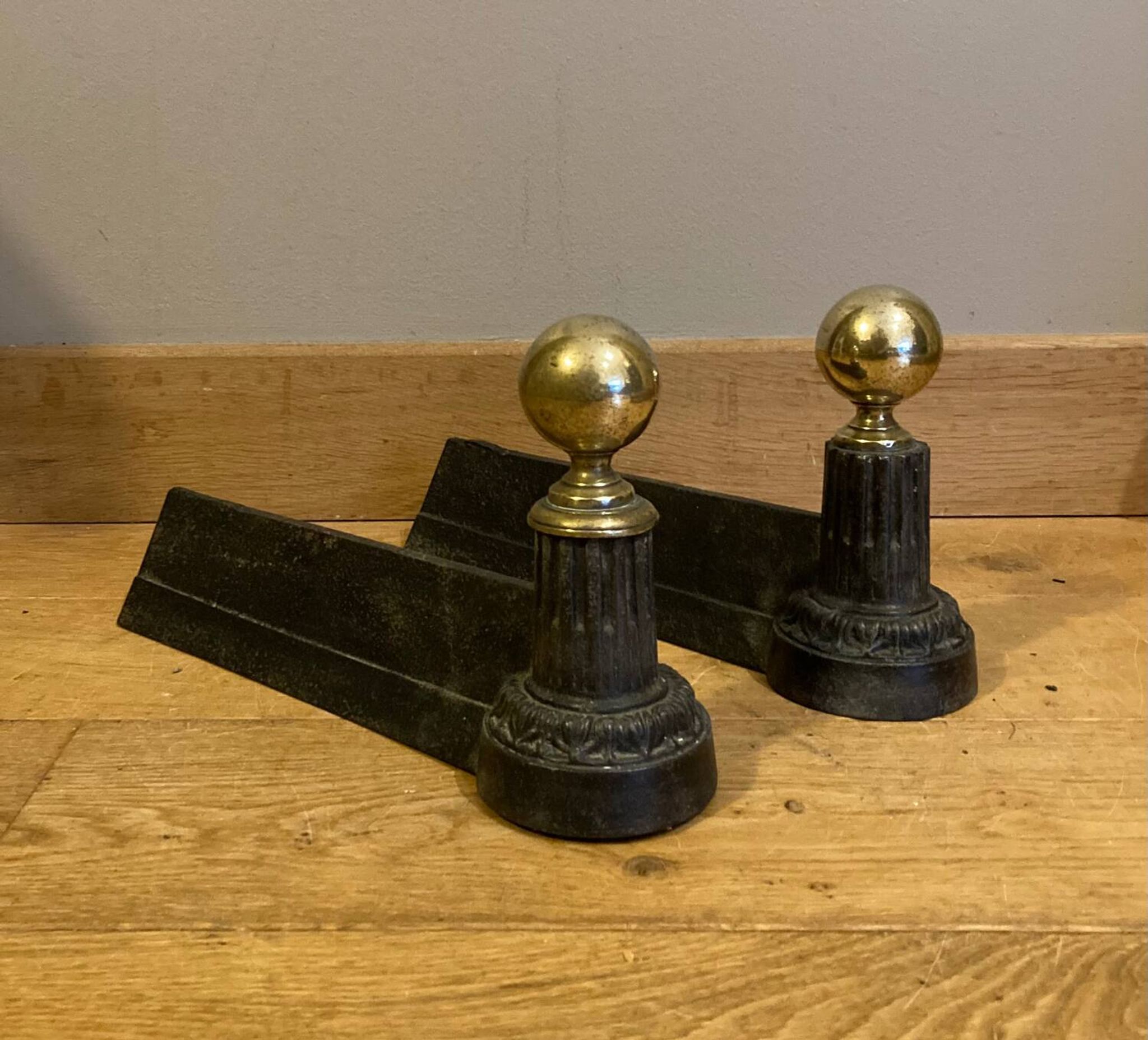 Pair of Napoleon III andirons from the 19th century in cast iron and brass