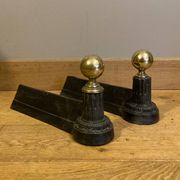 Pair of Napoleon III andirons from the 19th century in cast iron and brass