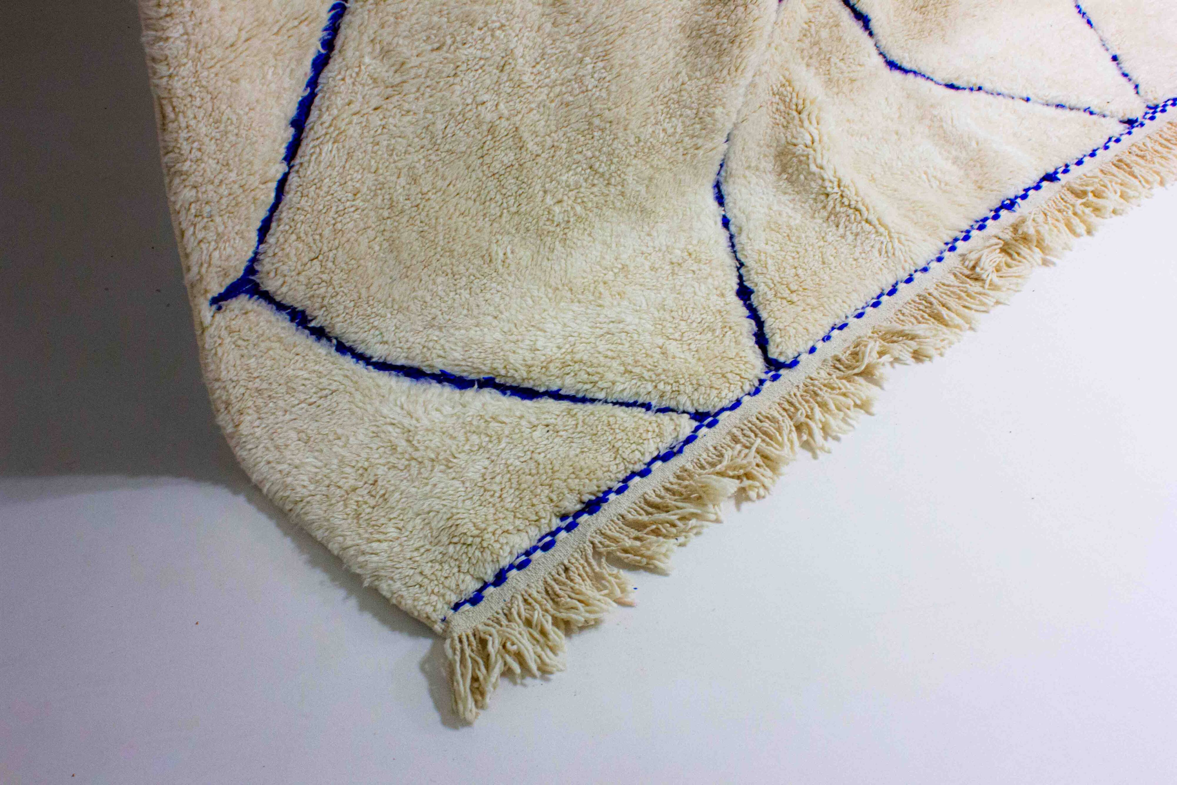 Vintage berber rug in ivory and blue wool