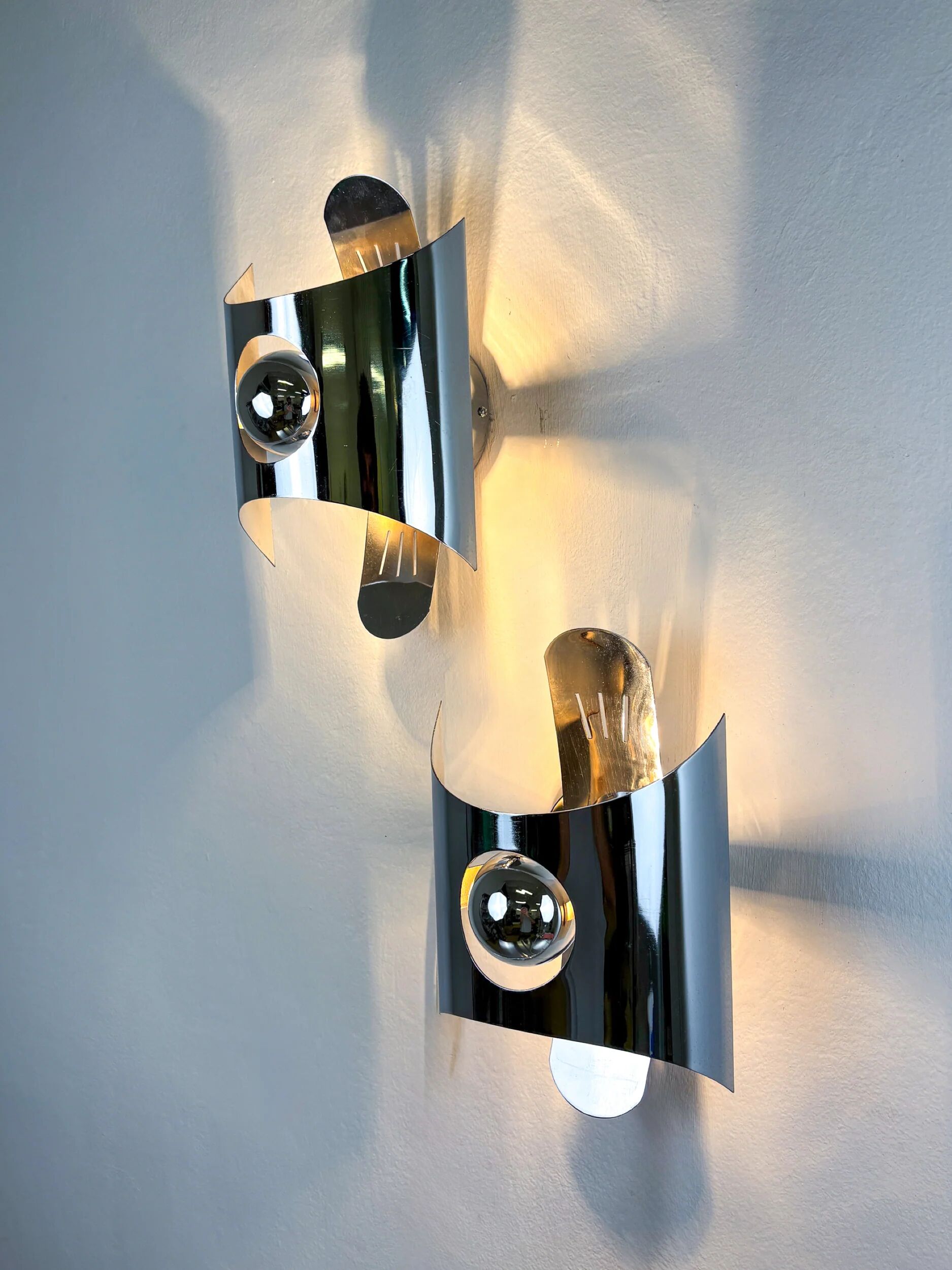 Pair of chromed space age wall lights, Italy, 1970s