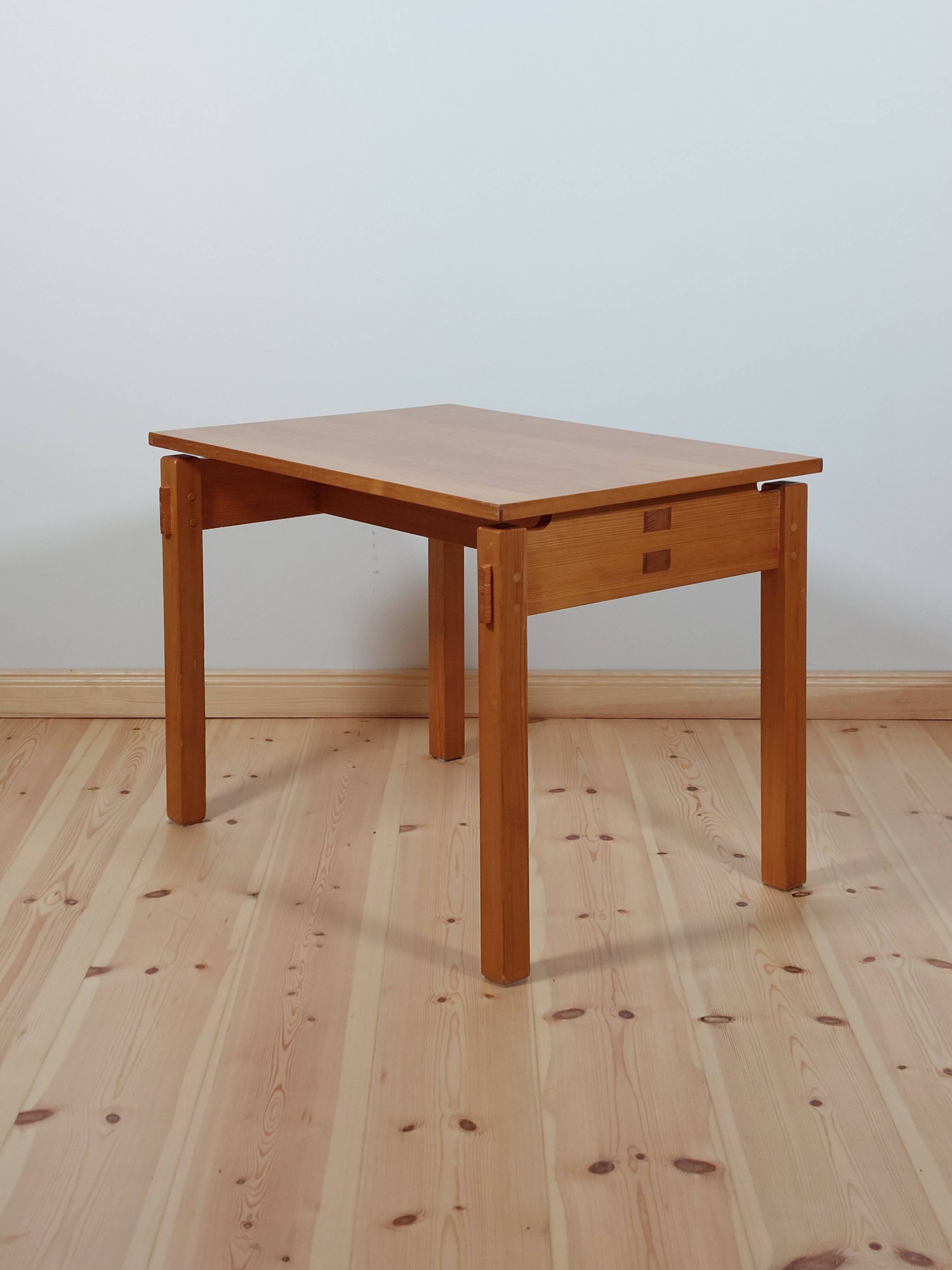 Meticulously crafted vintage pine side table, a masterpiece.