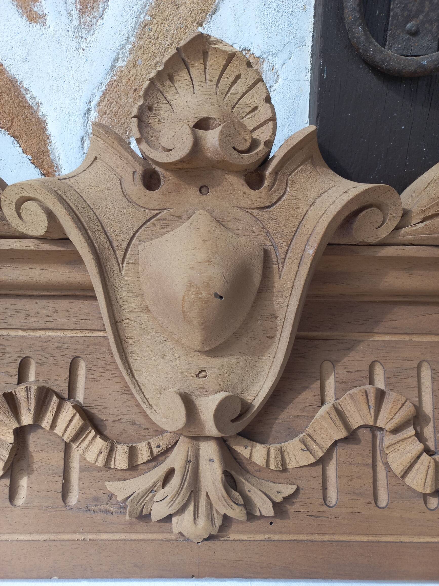 Old sandblasted wooden pediment