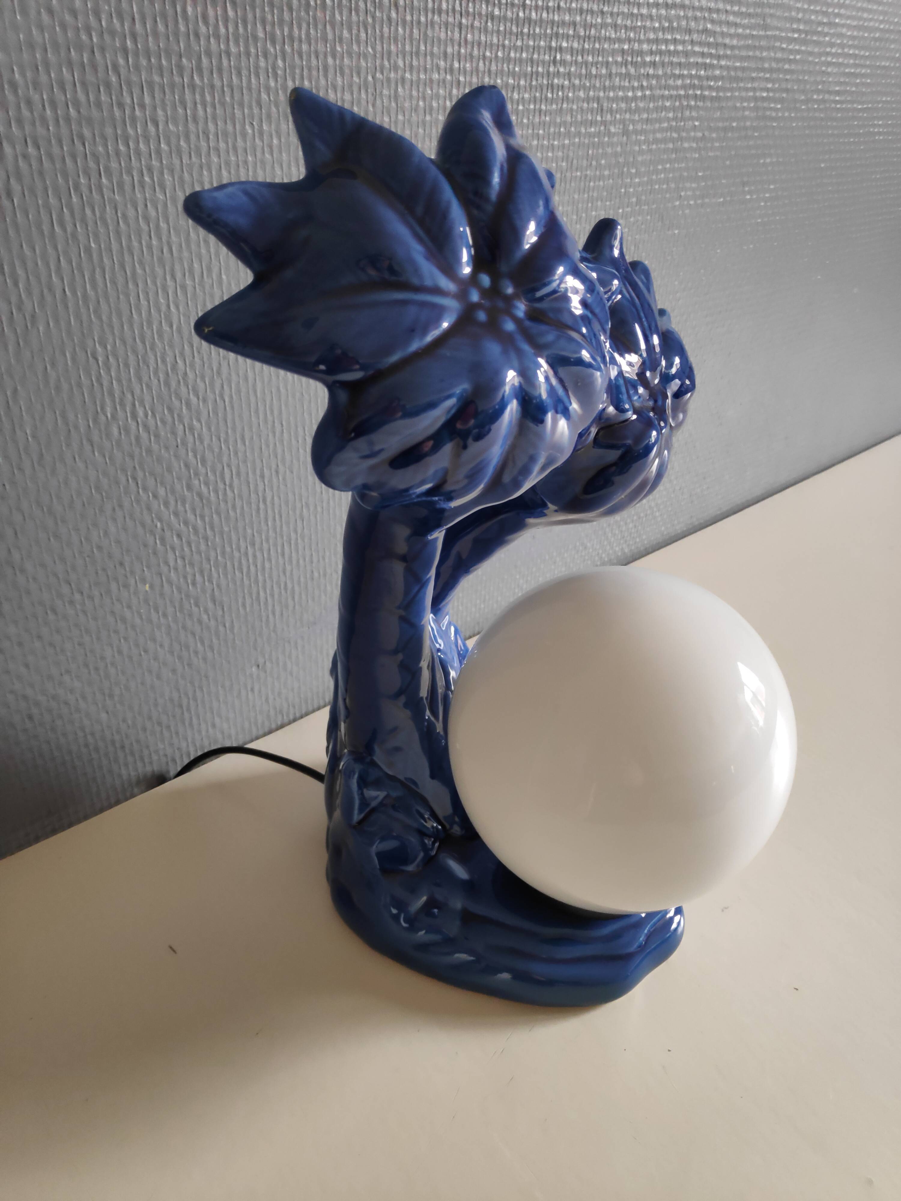 Blue ceramic palm lamp and white opaline globe