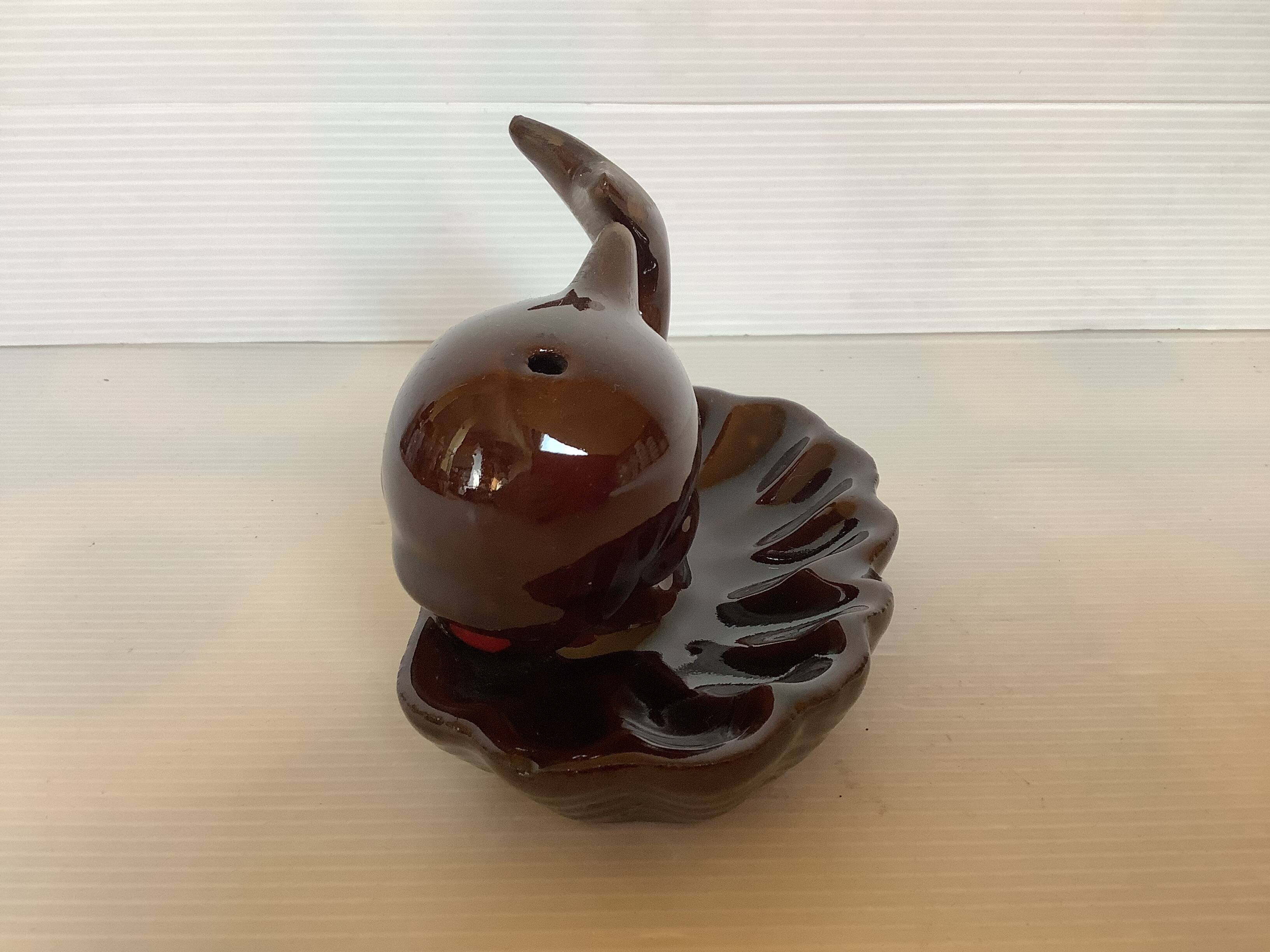 Whale-shaped pocket ashtray