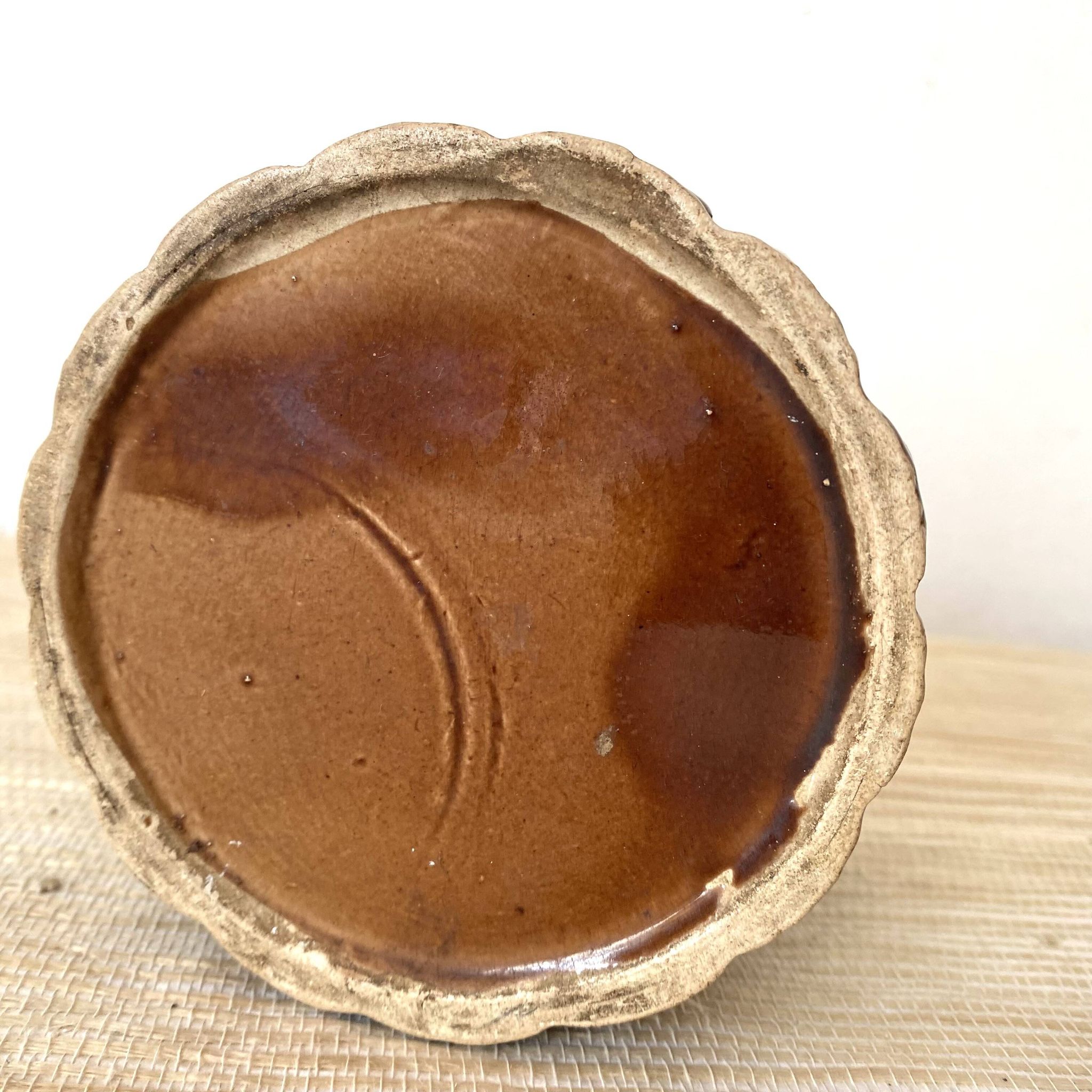Antique slip pot with acorn decoration