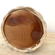 Antique slip pot with acorn decoration