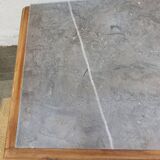 Vintage wooden buffet with a marble top.