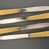 Set de 4 anciens couteaux de table inox et bakelite