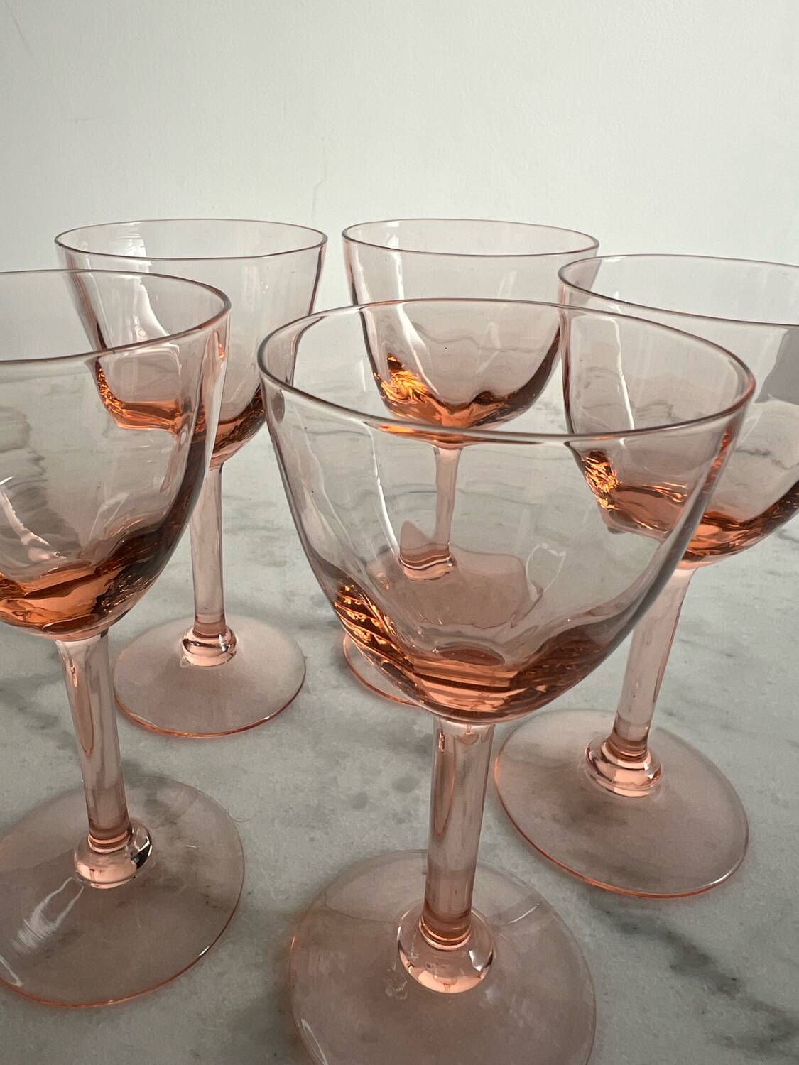 5 small pink glass stemmed glasses