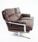 Two seater sofa upholstered with patinated brown leather and frame in metal, designed by Arne Norell