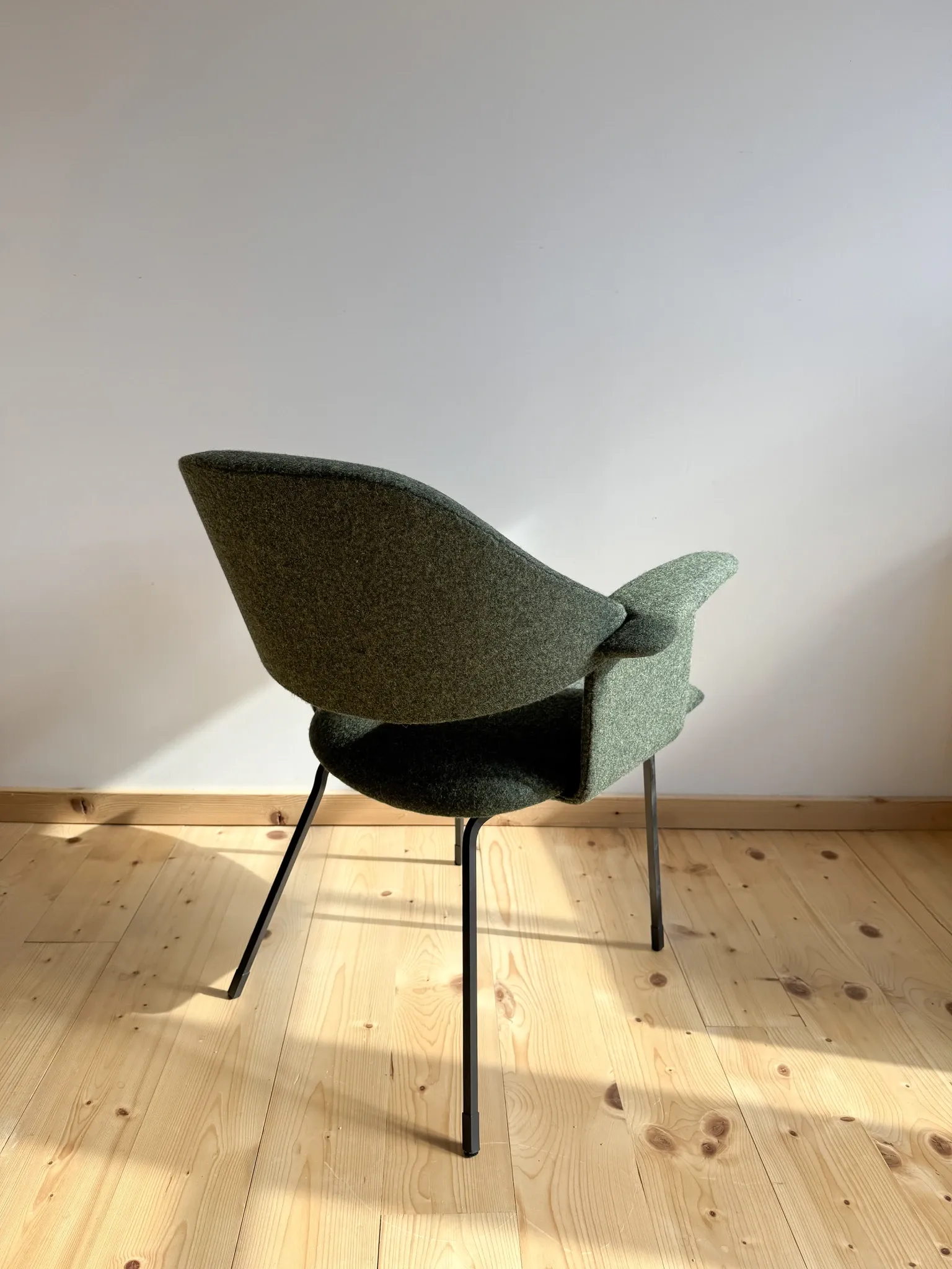 Curved vintage wool armchair from the 1960s