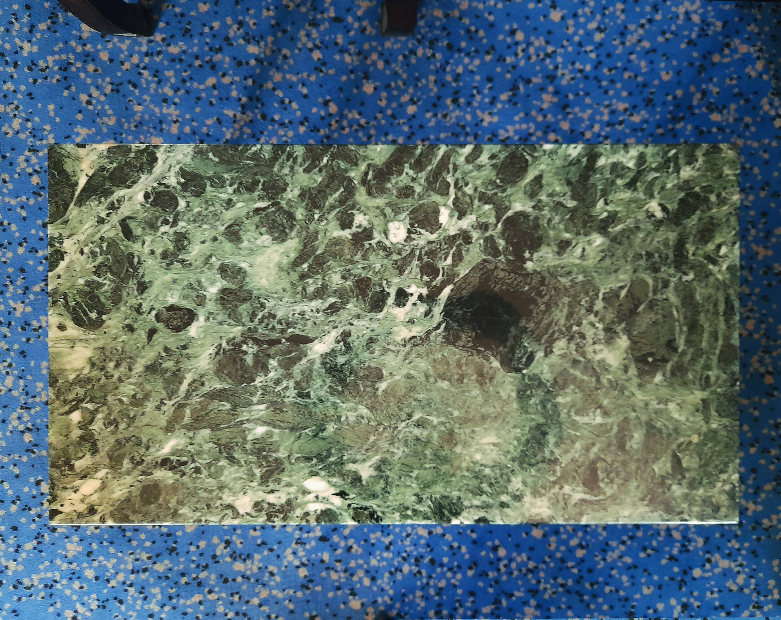 Coffee table in gilded bronze and green Alpine marble