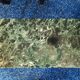 Coffee table in gilded bronze and green Alpine marble
