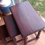 Nesting tables in oak wood. Turned wooden legs.