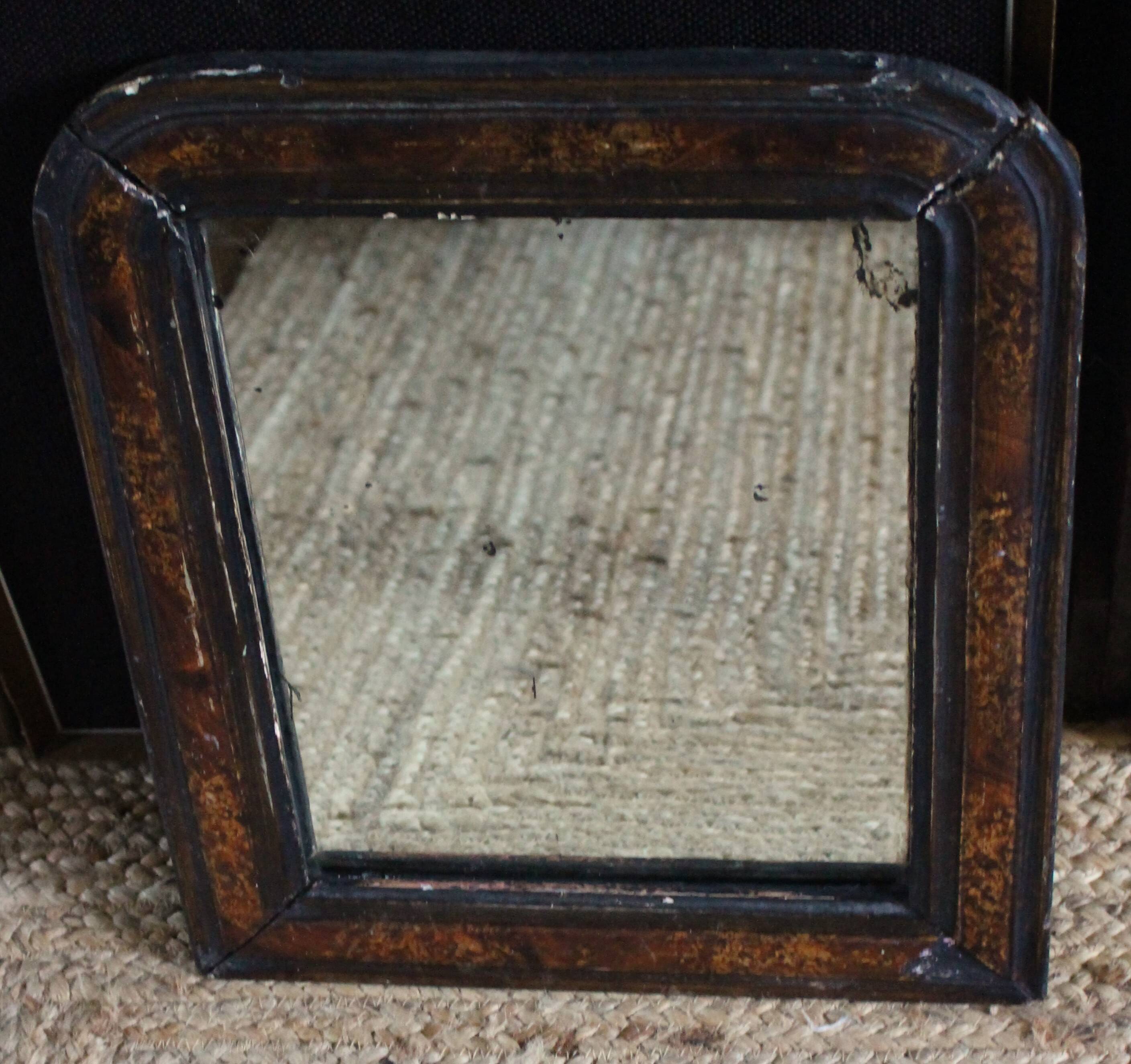 Antique Louis Philippe mirror in black and brown.
