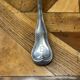 Christofle brand ladle in silver metal - Letter B on the back.