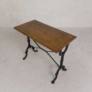 Bistro table with an oak top on a cast iron base, 1930s.