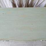 Curved patinated chest of drawers