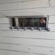 Aluminum wall coat rack with pivoting mirror from the 60s