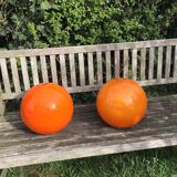 Two orange opaline globes, 30 cm diameter