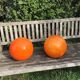 Two orange opaline globes, 30 cm diameter